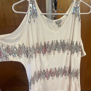 White with silver sequins on the shirt and open on the sleeves